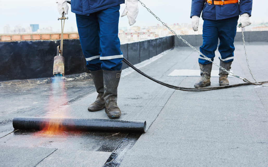 Commercial rooftop repairs being made on building